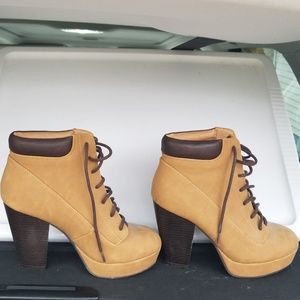 Brown and tan heeled booties